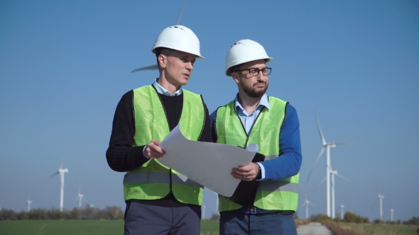 Two Engineers Discussing Against Wind Farm