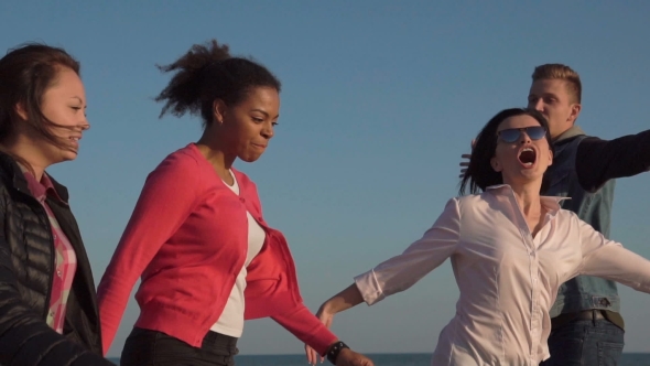 Laughing Youth Running on Shoreline