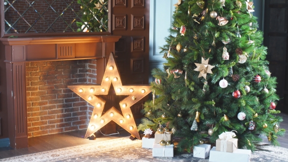 Christmas Room. Christmas Tree By the Fireplace