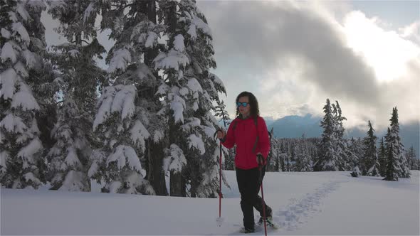 Adventure Woman Hiking on Top of Canadian Mountains