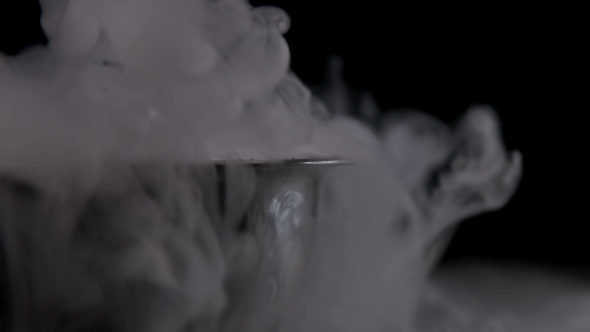 Boiling Pot of Smoke on Black Background