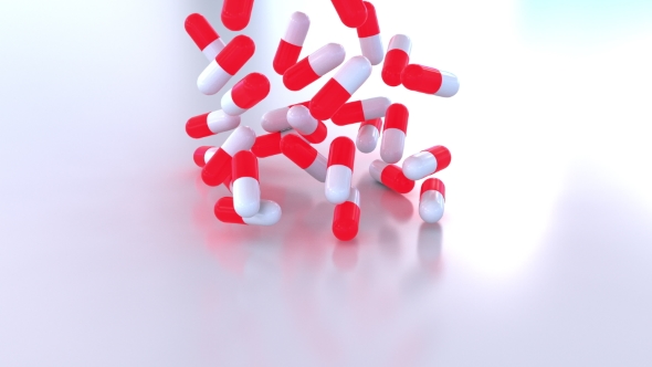 Pouring Red and White Drug Capsules or Pills alt