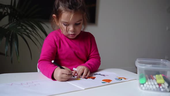 Toddler Girl Drawing with Colourful Markers