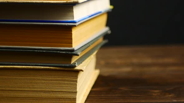 Old books on a wooden shelf