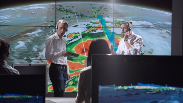 Researchers Tracking Hurricane on Monitor alt
