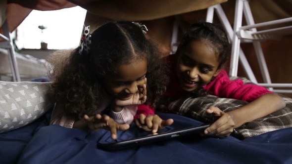 Smiling African American Girls Using Tablet Pc