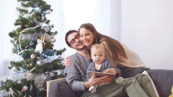 Happy Family Buying on the Internet for Christmas Gifts