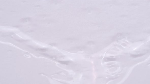 Transparent Liquid Spreads Over a Background