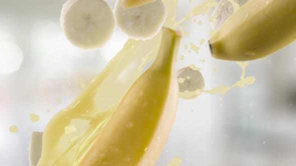 Banana with Slices Falling on Kitchen Background