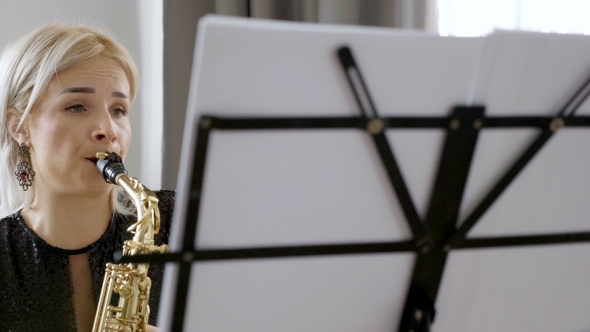 Jazz Saxophone Player Performing on the Sax in the Living Room