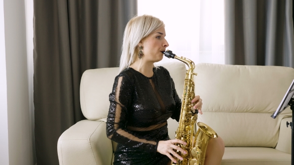 Jazz Saxophone Player Performing on the Sax in the Living Room