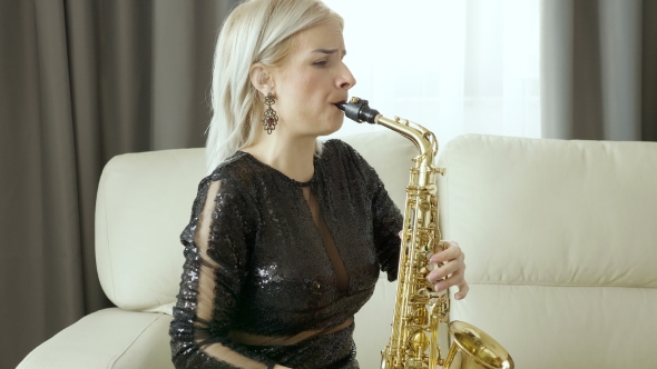 Jazz Saxophone Player Performing on the Sax in the Living Room