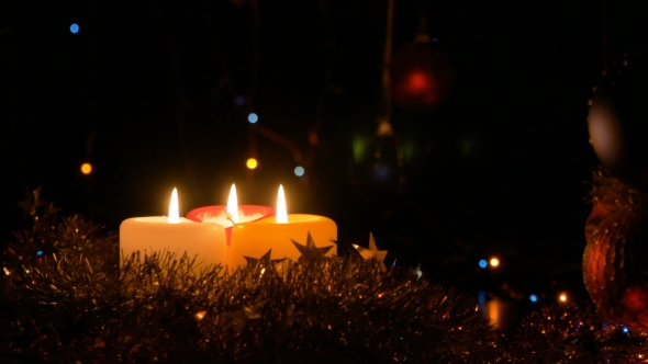 Christmas Candles on a Dark Background Flashing Garlands