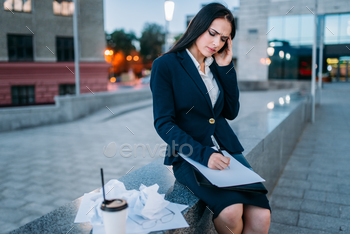 ments, business center on background. Modern building, cityscape. Female businessperson