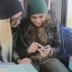 Smart Phone People Sharing and Watching Funny Video Laughing While Traveling in Train on Commute - VideoHive Item for Sale