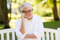 senior man calling on smartphone at summer park - PhotoDune Item for Sale