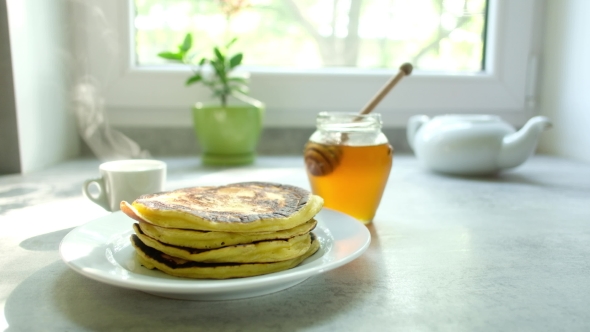 The Man Turns the Pancake