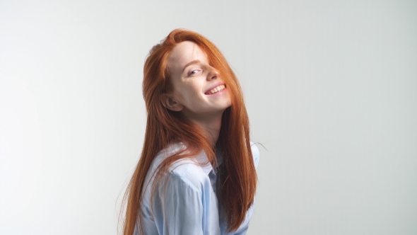 Portrait of Young Attractive Redhead Girl Smiling Looking at Camera. Isolated on White Background.