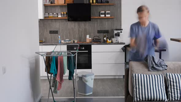 The Woman Is Cleaning the Kitchen