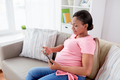 happy pregnant woman with tablet pc at home - PhotoDune Item for Sale