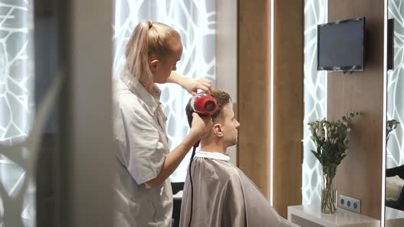 Female Master Is Making Stylish Fashion and Attractive Hairstyle To Male Client