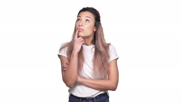 Studio Portrait of Caucasian Woman in Casual Tshirt Thinking or Counting Cons and Prons Over White