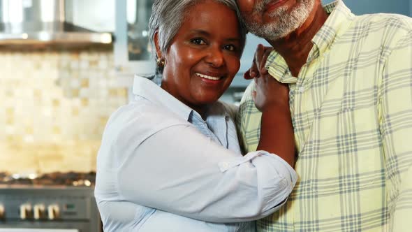 Senior couple standing in kitchen