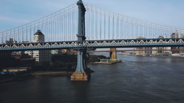 Aerial View of the Manhattan Bridge Through the East River in New York, America. Drone Flying Along