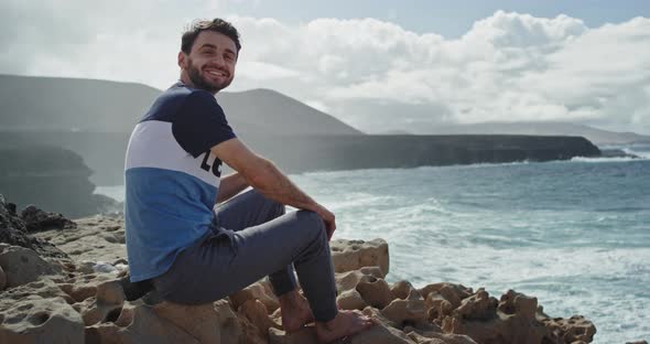 Young Attractive Guy with a Large Smile Enjoying