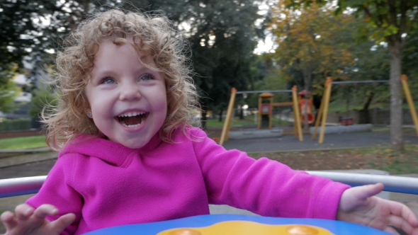 Happy Child on a Carousel