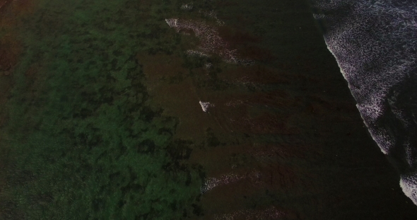 Aerial Drone  Footage of Ocean Waves Breaking Before the Shore Bali, Indonesia