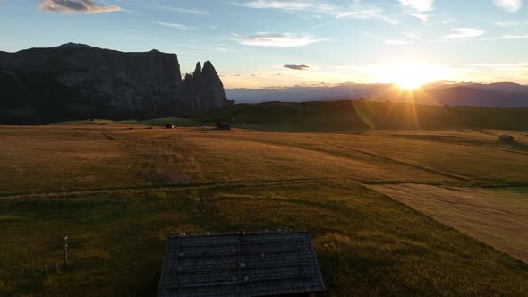 Dolomites mountains peaks with a hiking path on a summer sunrise