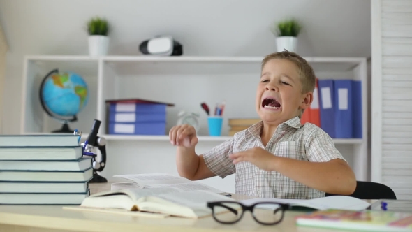 Schoolboy Was Tired and Fell Asleep at Desk at School