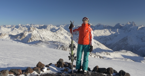 Woman Holds Ski at Mountain Lookout Point