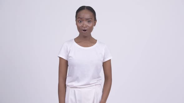Young Stressed African Woman Looking Sad and Giving Thumbs Down