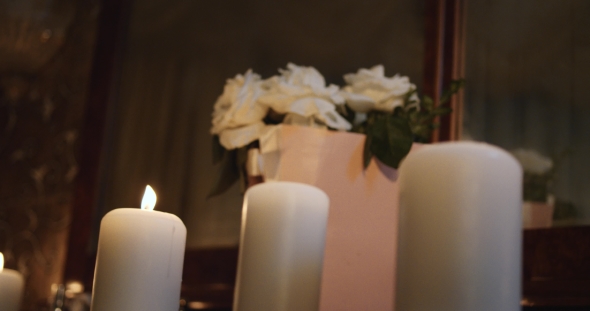 Flickering Candles , Romantic Atmosphere, Flowers on Background