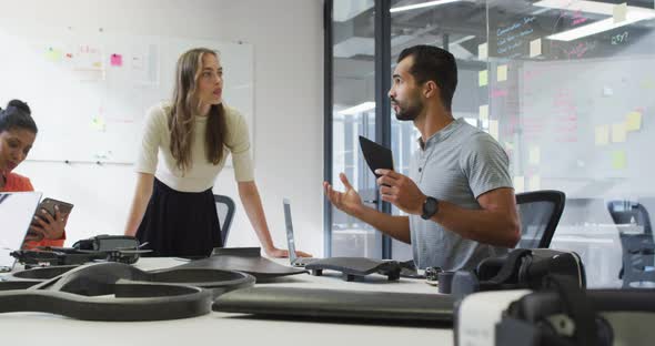 Diverse group of work colleagues brainstorming in meeting room