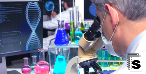 Chemist Looking Through Microscope alt