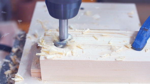 Drilling a Hole in a Piece of Wood with a Drill Press