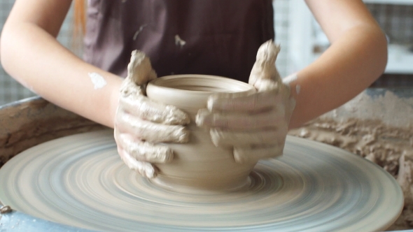 Pottery Class Workshop. Clay Shaping on Potter's Wheel and Firing.