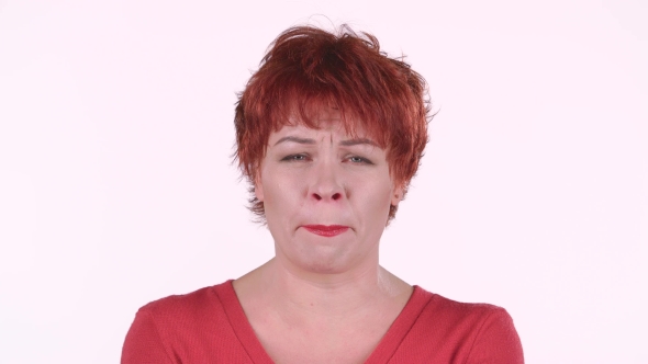 Red Haired Woman Screams, She Is Aggressively Attuned To Her Colleagues. White Background