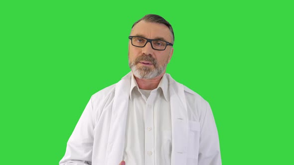 Doctor Talk Concept Mature Male Therapist Share Information Provide Support on a Green Screen Chroma