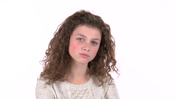 Little Girl Is Sad, She Was Riddled with Unpleasant News. White Background