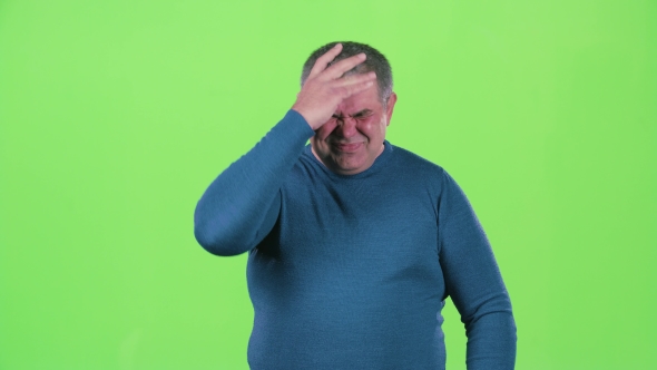 Headache Torments Middle Aged Man. Green Screen