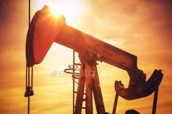 Sunset. Oil Industry Theme with Pumping Unit.
