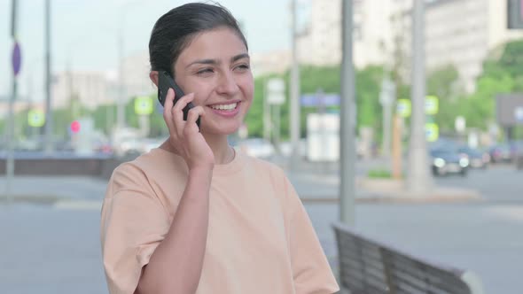 Portrait of Indian Woman Talking on Phone