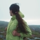Rotation View of Young Long-haired Woman Looking Around in a Foggy Mountains - VideoHive Item for Sale