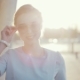 Young Business Woman Walking Down the Street in Shining Sunlight, Then She Turns To - VideoHive Item for Sale