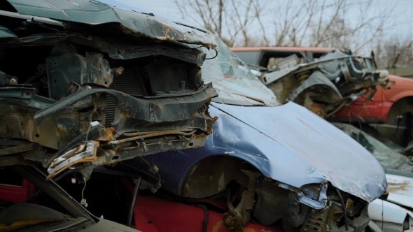 Wrecked Old Cars in Stacks alt
