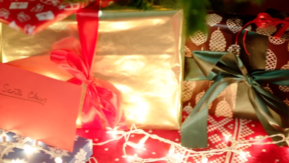 Christmas Letter for Santa Claus and Beautiful Gift Boxes Under the Christmas Tree